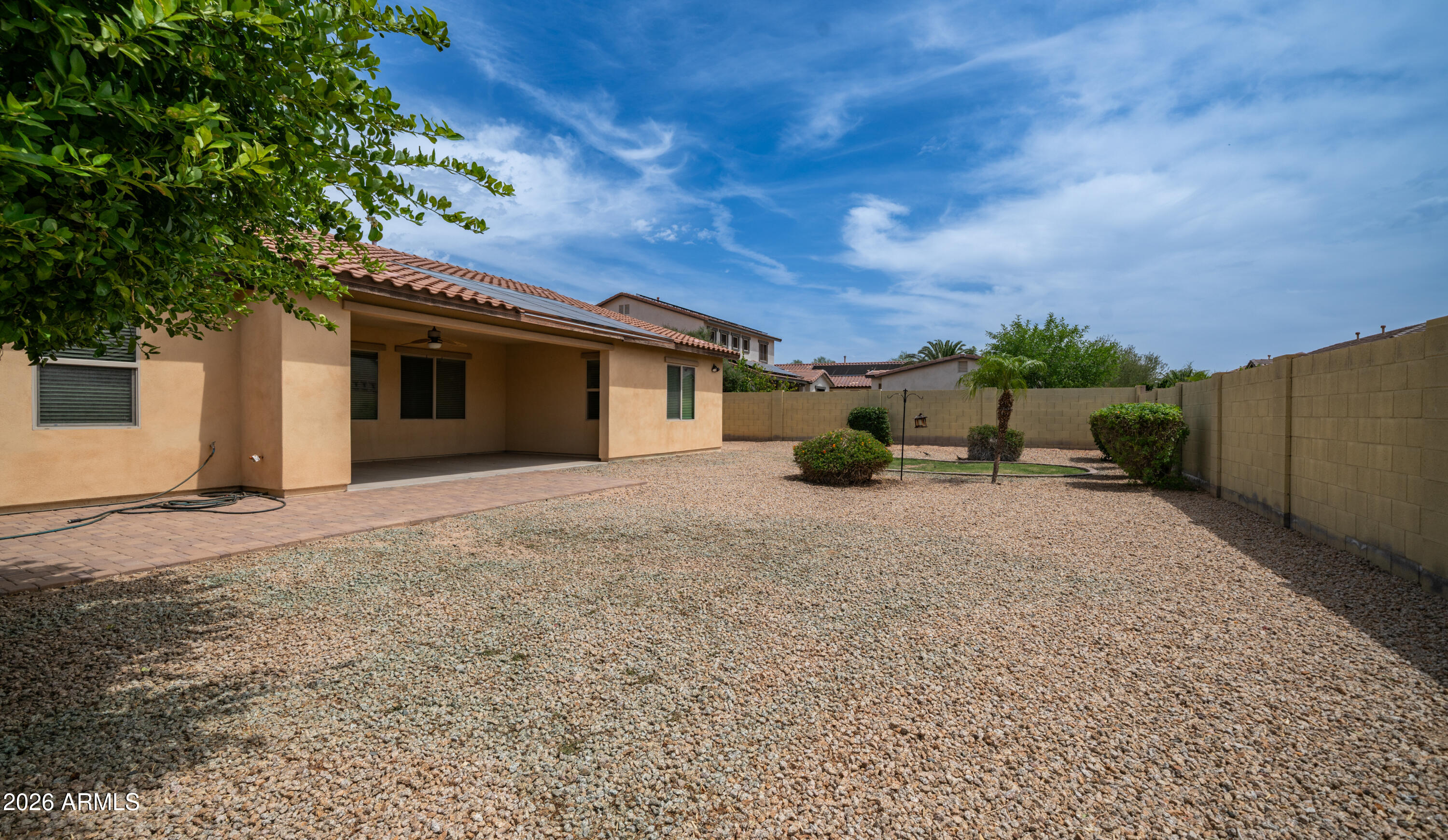 16159 West Granada Road Goodyear, AZ 85395 - Photo 37 of 41 a view of a house with backyard and a tree