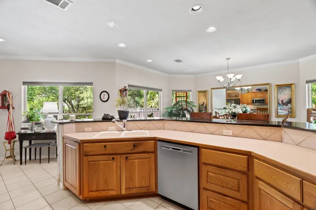 a kitchen with sink and cabinets