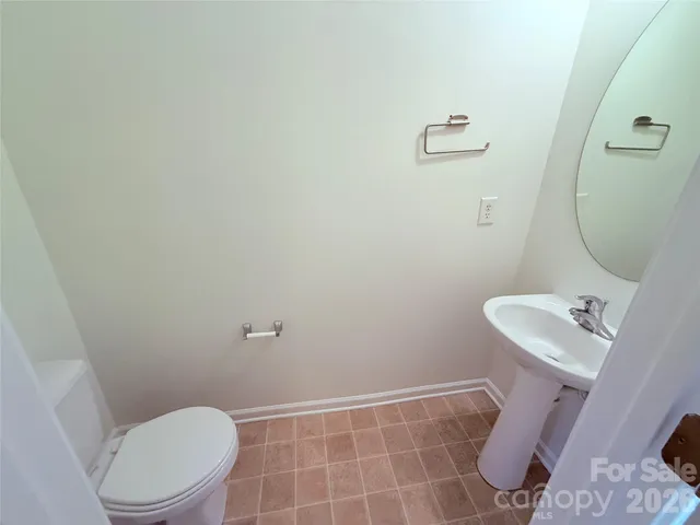 a bathroom with a toilet and a sink