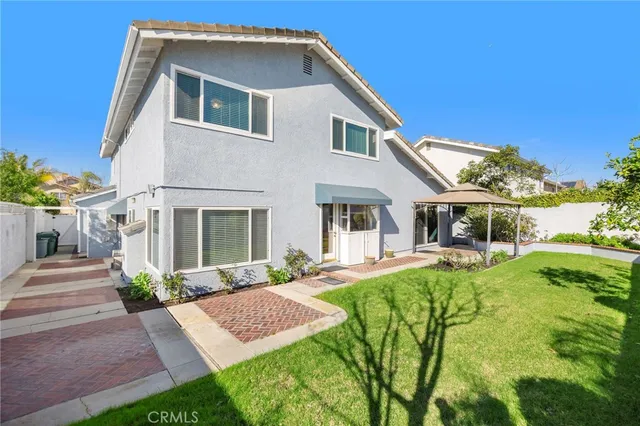 a front view of a house with a yard and porch