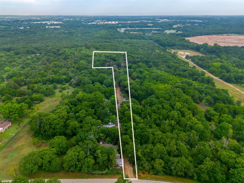 8635 Retta Mansfield Road Mansfield, TX 76063 - Photo 4 of 11 a view of a field with a view of a city