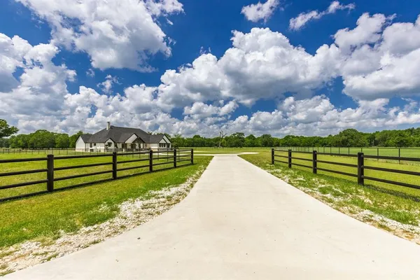 a view of park with wooden fence