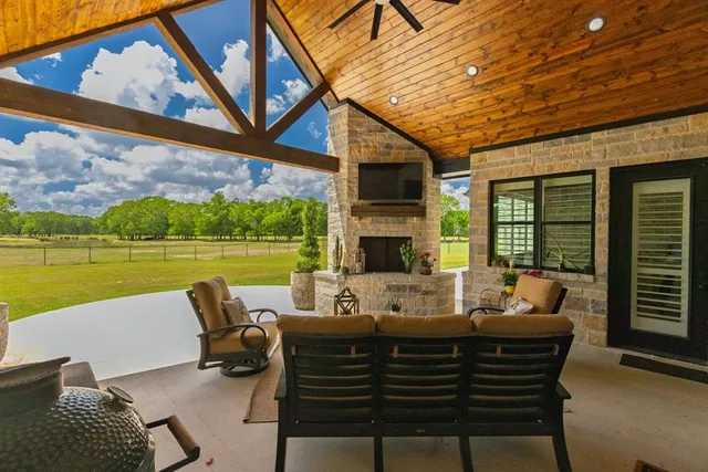a view of a patio with couches chairs and a table