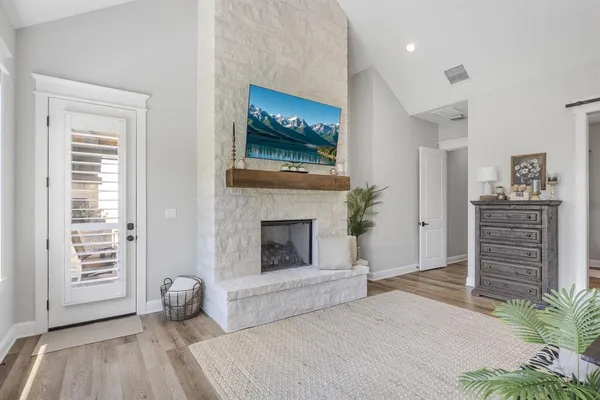 a bedroom with a bed and a fireplace