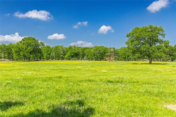 a view of a swimming pool with an outdoor space and seating area
