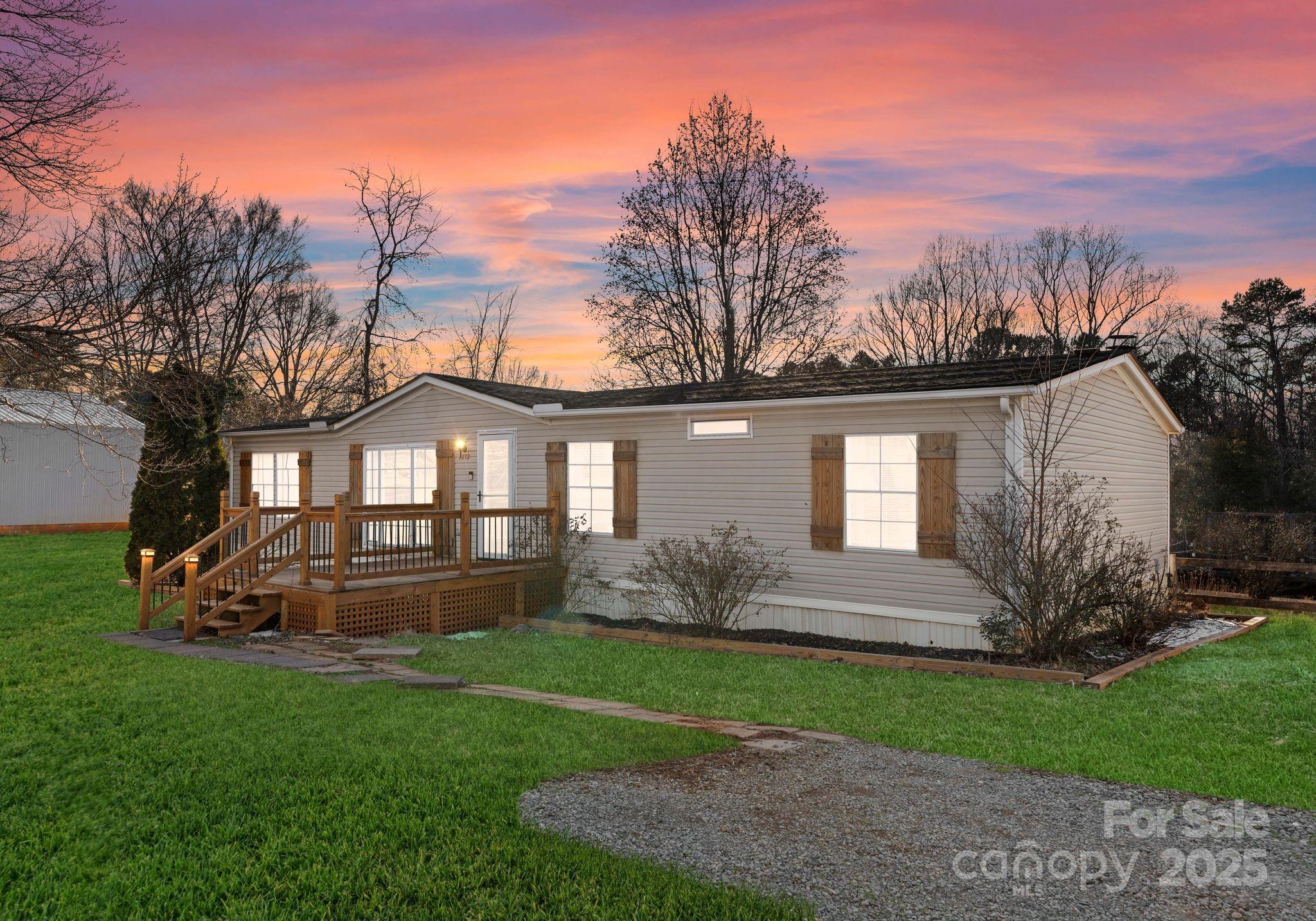1812 Shearers Road Davidson, NC 28036 - Photo 1 of 40 a front view of a house with garden