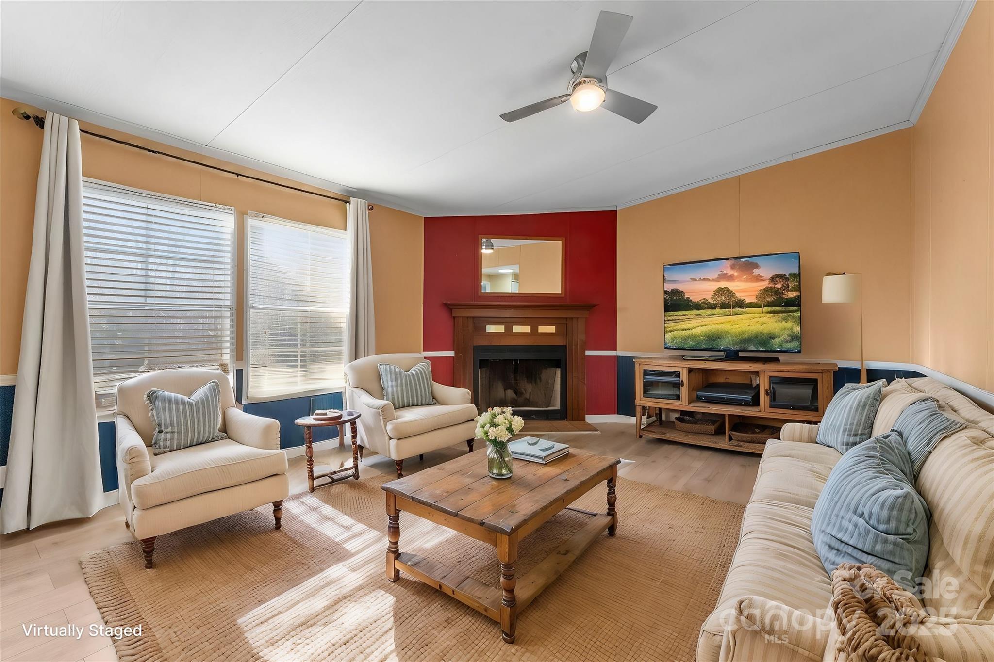 1812 Shearers Road Davidson, NC 28036 - Photo 19 of 40 a living room with furniture and a flat screen tv