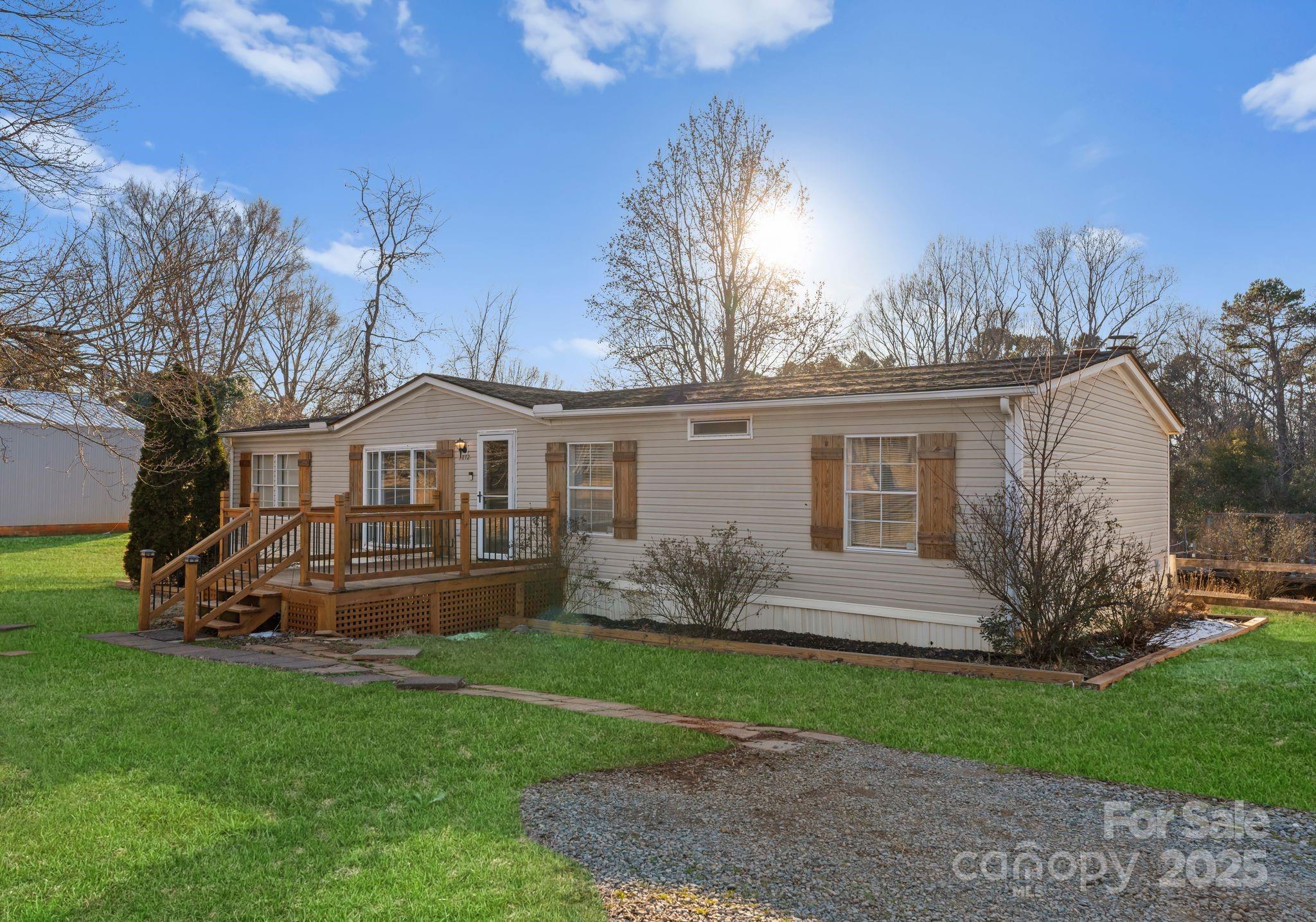 1812 Shearers Road Davidson, NC 28036 - Photo 2 of 40 a front view of a house with garden