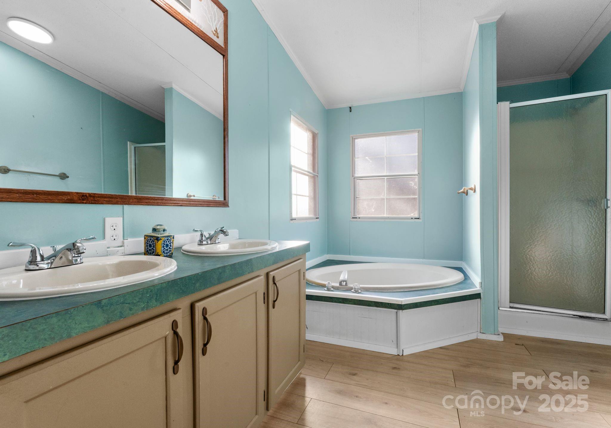 1812 Shearers Road Davidson, NC 28036 - Photo 23 of 40 a bathroom with a toilet sink a mirror and window