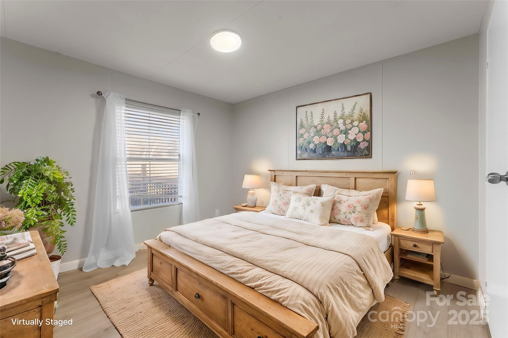1812 Shearers Road Davidson, NC 28036 - Photo 25 of 40 a bedroom with a large bed and a potted plant