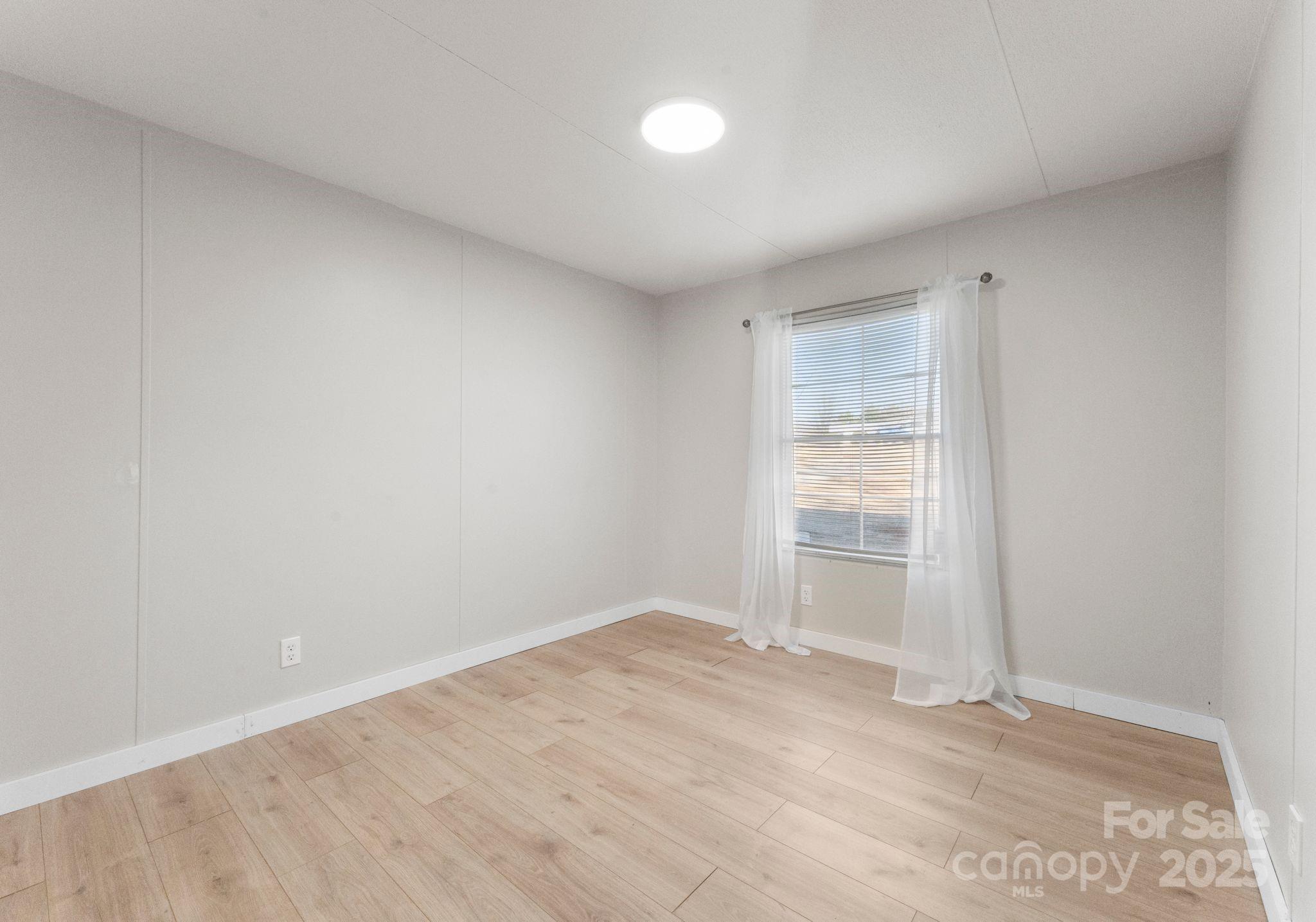 1812 Shearers Road Davidson, NC 28036 - Photo 26 of 40 a view of an empty room with a window