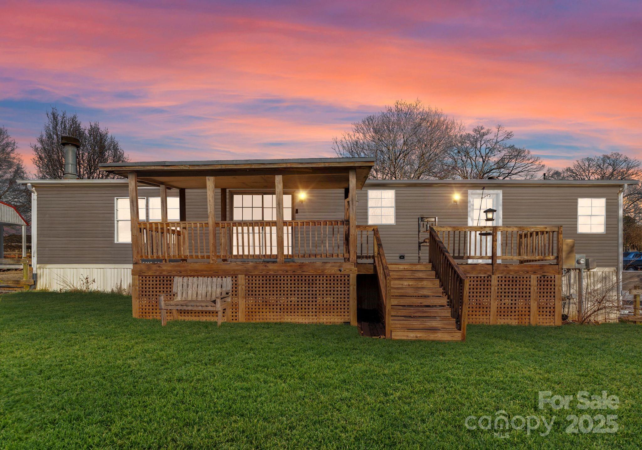 1812 Shearers Road Davidson, NC 28036 - Photo 29 of 40 a view of a house with a backyard