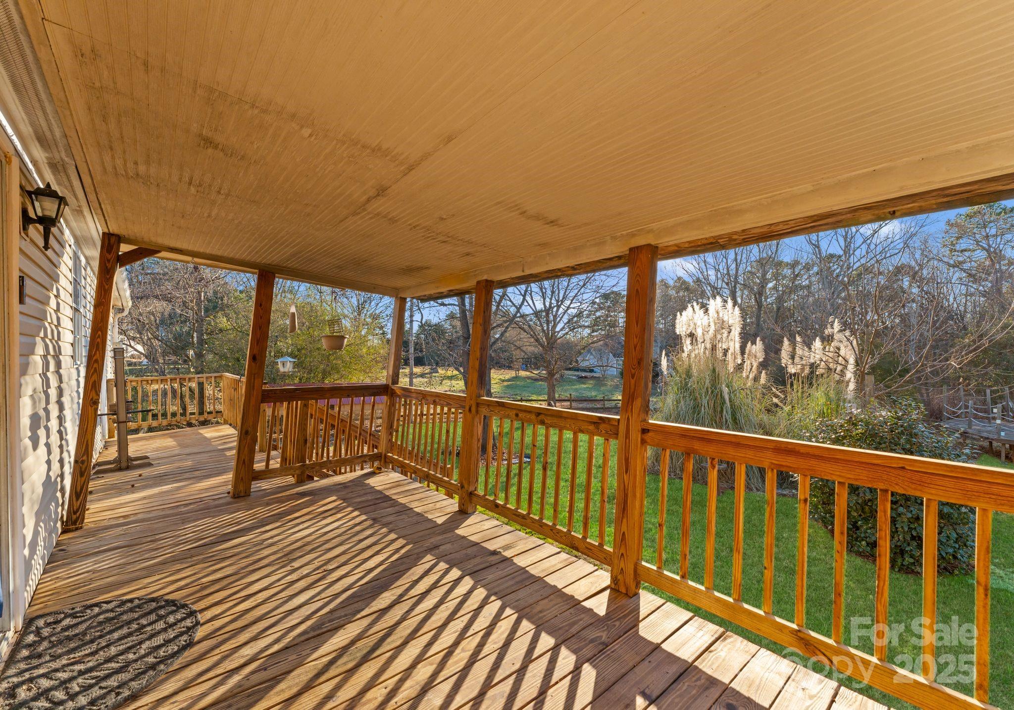 1812 Shearers Road Davidson, NC 28036 - Photo 30 of 40 a view of a balcony with wooden floor