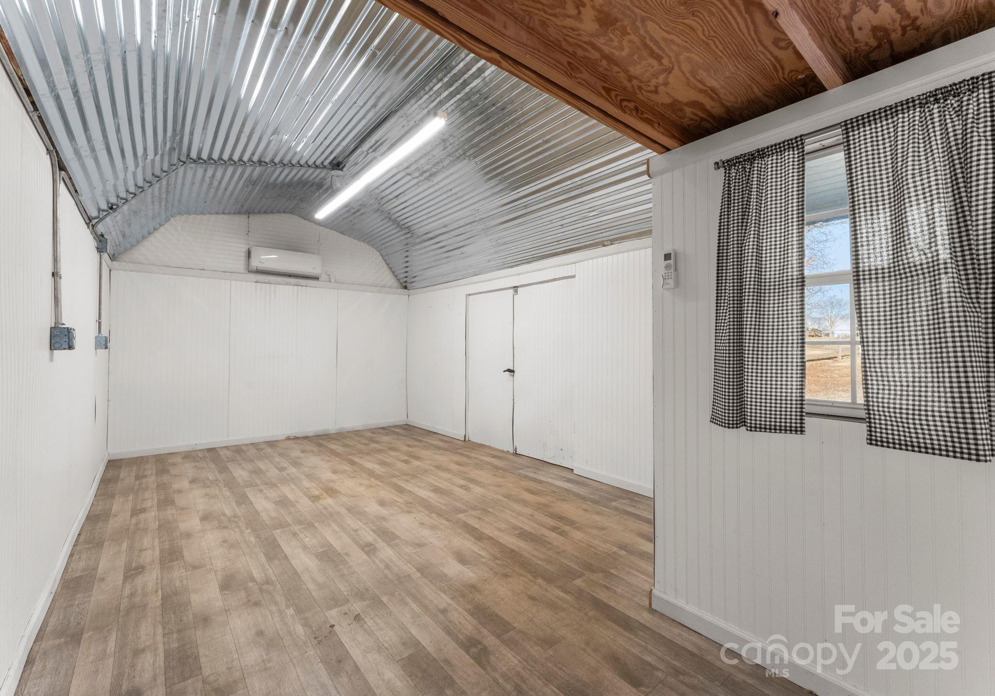 1812 Shearers Road Davidson, NC 28036 - Photo 35 of 40 a view of empty room with wooden floor