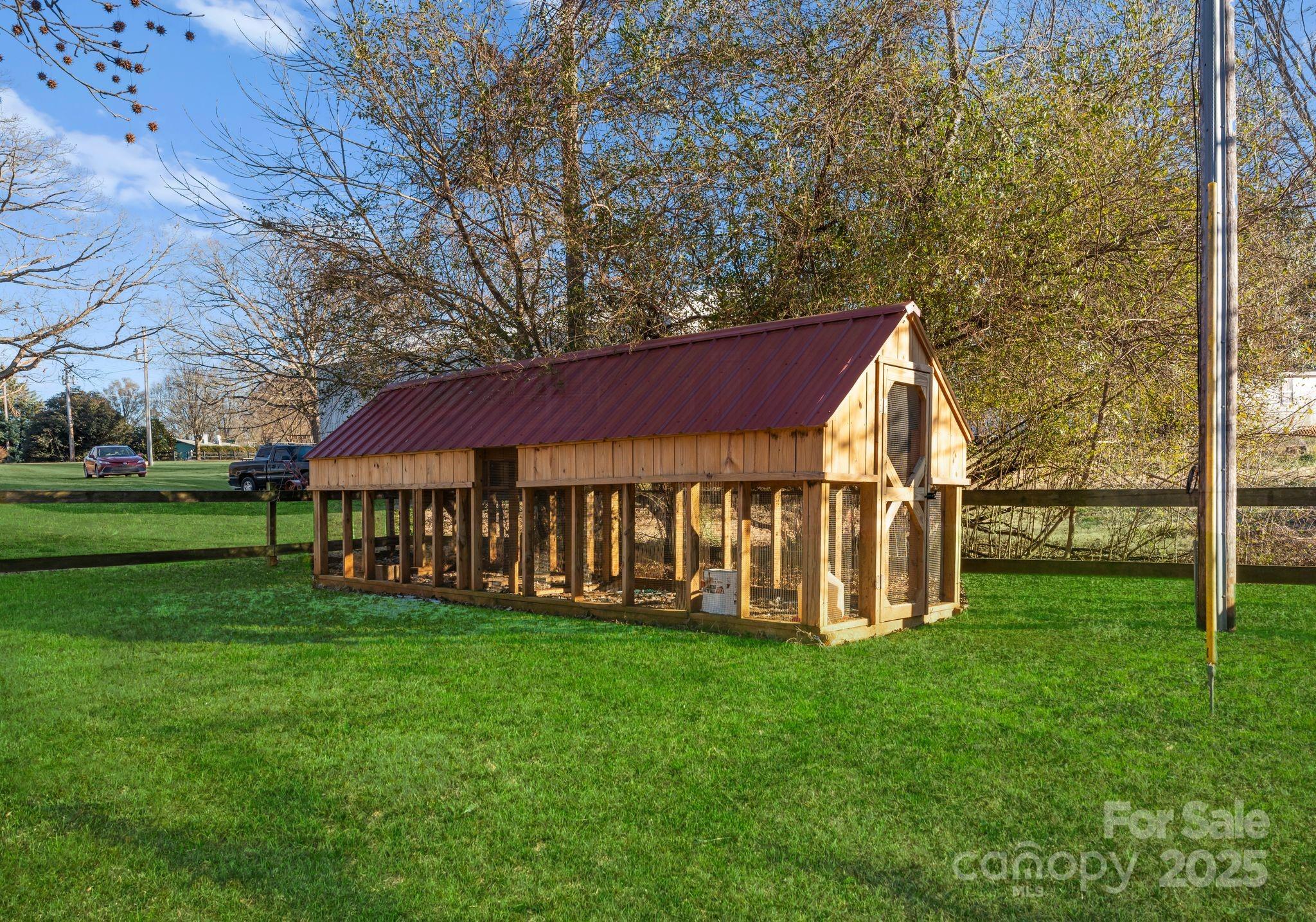 1812 Shearers Road Davidson, NC 28036 - Photo 38 of 40 a view of a house with a yard and sitting area