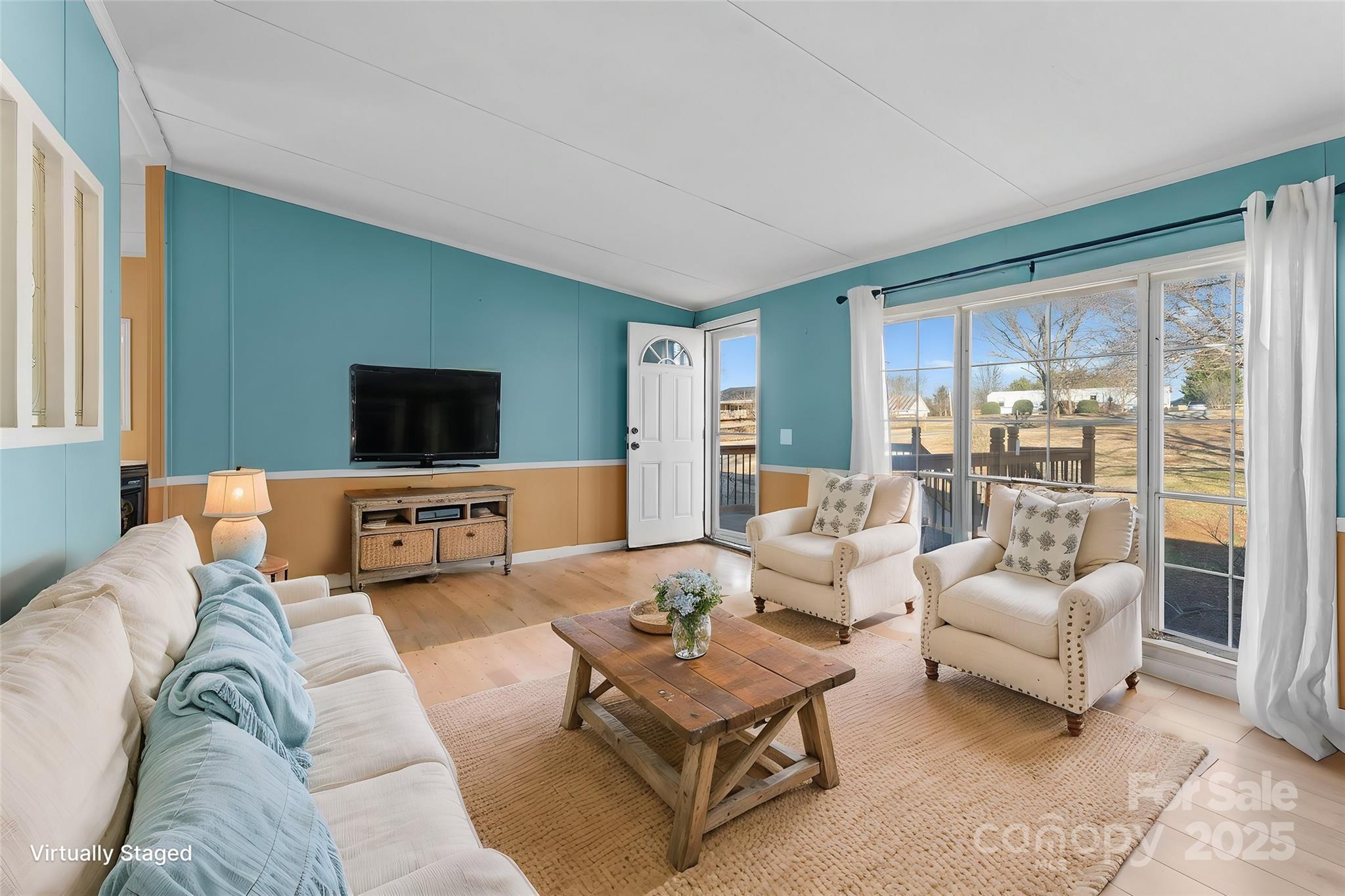 1812 Shearers Road Davidson, NC 28036 - Photo 6 of 40 a living room with furniture and a flat screen tv
