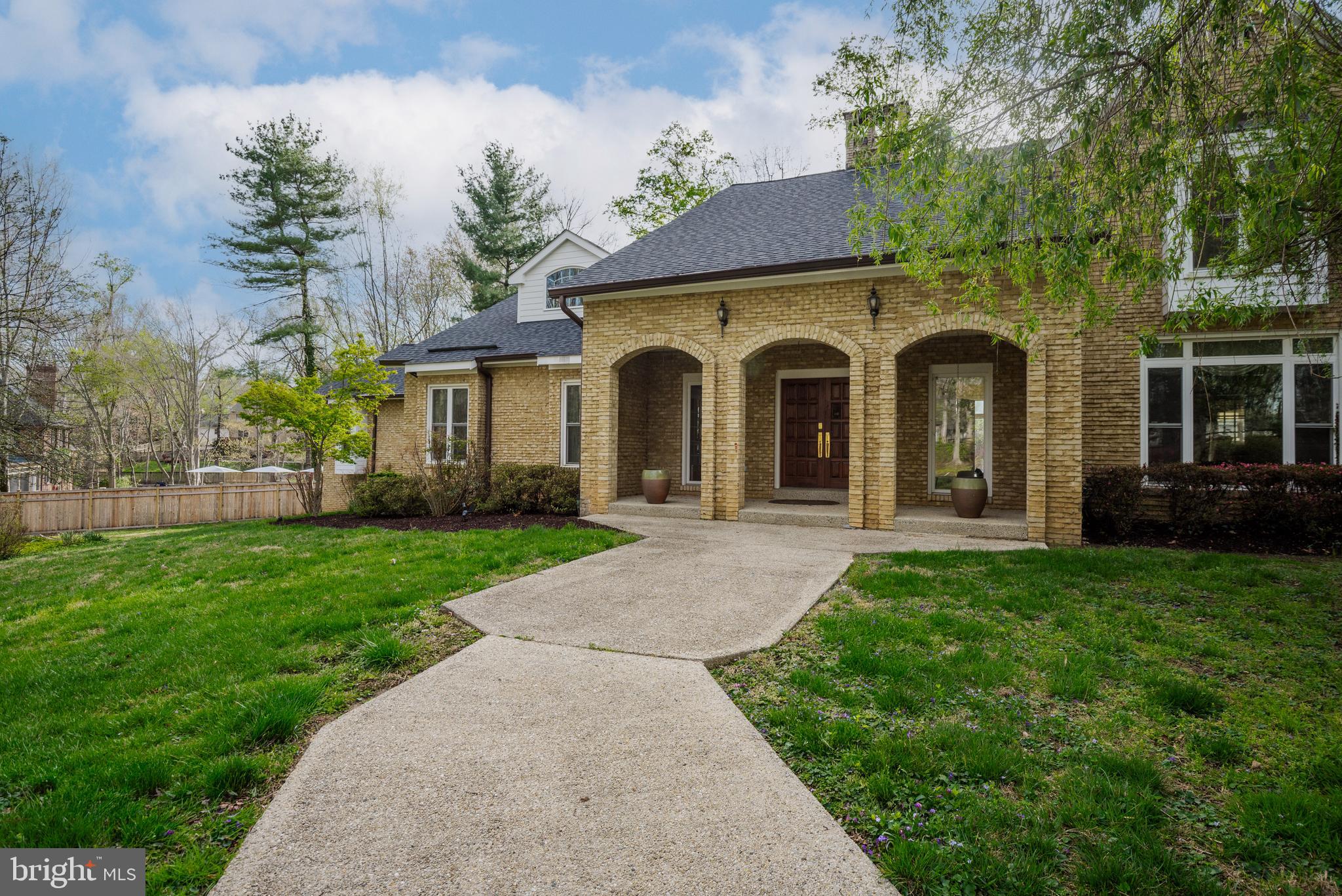 10100 Iron Gate Road Potomac, MD 20854 - Photo 10 of 16 a front view of a house with garden