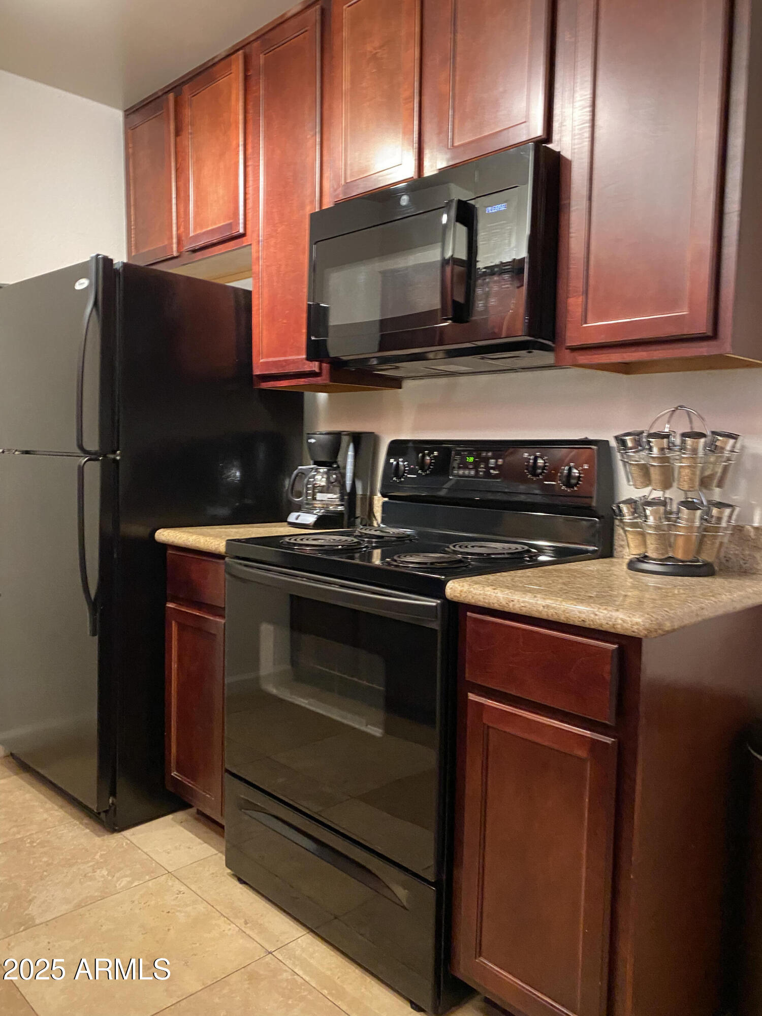 3500 North Hayden Road, Unit 105 Scottsdale, AZ 85251 - Photo 1 of 12 a kitchen with stainless steel appliances granite countertop a stove microwave and refrigerator