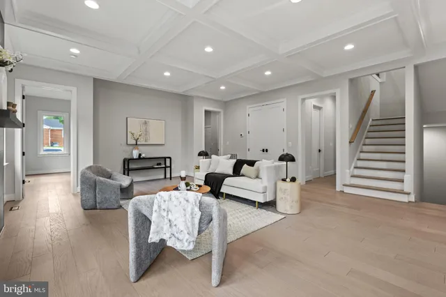 an empty room with a ceiling fan and window