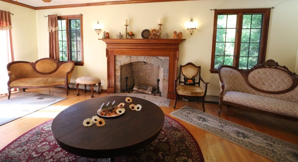 14 Gerrish Road Rochester, MA 02770 - Photo 12 of 40 a living room with furniture and a fireplace
