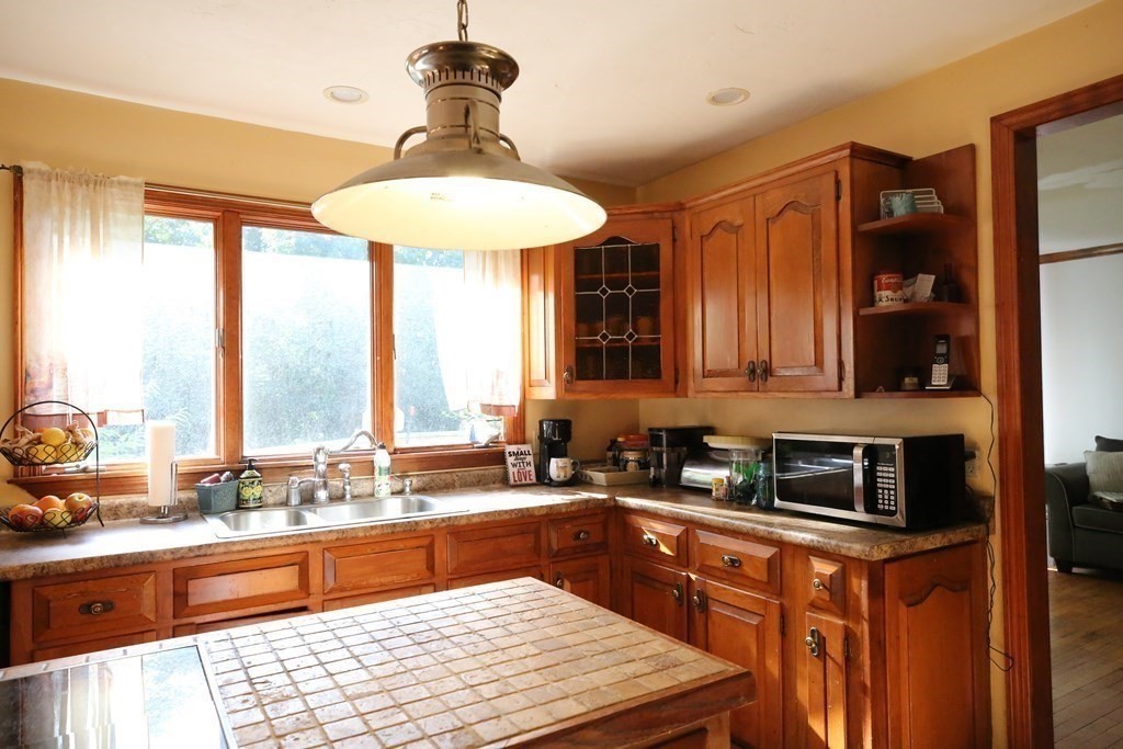 14 Gerrish Road Rochester, MA 02770 - Photo 16 of 40 a kitchen with stainless steel appliances granite countertop a sink and cabinets