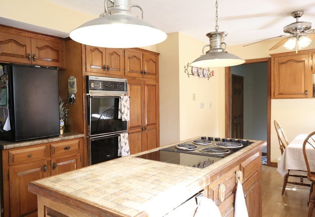 14 Gerrish Road Rochester, MA 02770 - Photo 17 of 40 a kitchen with stainless steel appliances granite countertop a stove refrigerator and microwave