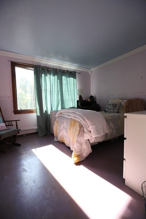 14 Gerrish Road Rochester, MA 02770 - Photo 24 of 40 a bedroom with a bed and a couch next to a window