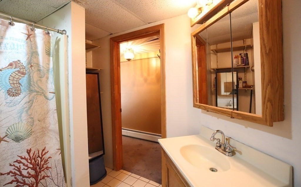 14 Gerrish Road Rochester, MA 02770 - Photo 37 of 40 a bathroom with a sink and a mirror