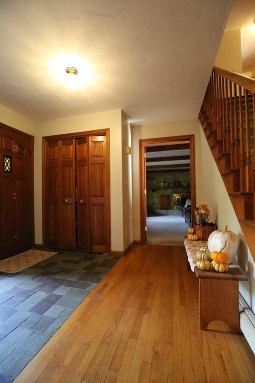 14 Gerrish Road Rochester, MA 02770 - Photo 6 of 40 a view of a livingroom with wooden floor and stairs