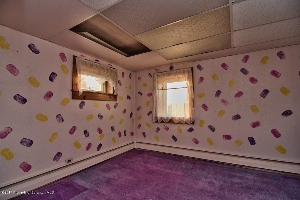 2350 Aberdeen Road Moscow, PA 18444 - Photo 7 of 36 a view of an empty room with window and chandelier