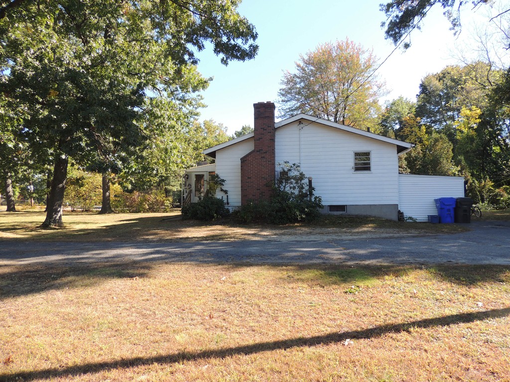 248 Fiberloid Street Springfield, MA 01151 - Photo 2 of 23 a view of a house with a yard