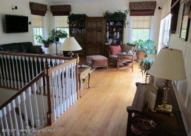 1121 Motichka Road Moscow, PA 18444 - Photo 15 of 59 a living room with furniture and a flat screen tv