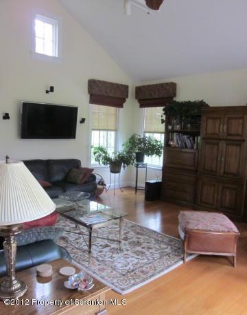 1121 Motichka Road Moscow, PA 18444 - Photo 17 of 59 a living room with furniture and a couch