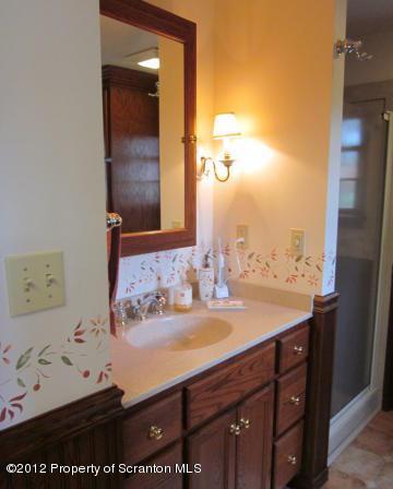 1121 Motichka Road Moscow, PA 18444 - Photo 23 of 59 a bathroom with a sink vanity and mirror