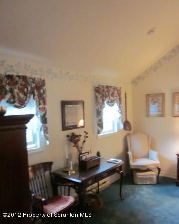 1121 Motichka Road Moscow, PA 18444 - Photo 30 of 59 a living room with furniture a rug and a window
