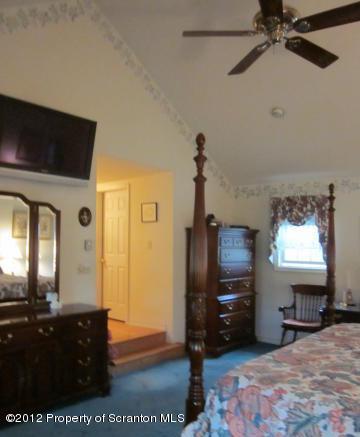 1121 Motichka Road Moscow, PA 18444 - Photo 31 of 59 a living room with furniture and a flat screen tv