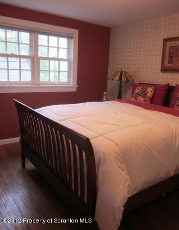 1121 Motichka Road Moscow, PA 18444 - Photo 35 of 59 a bedroom with a bed and a large window