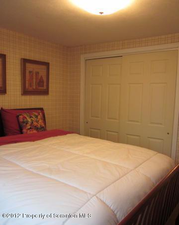 1121 Motichka Road Moscow, PA 18444 - Photo 36 of 59 a bedroom with a bed and a shower