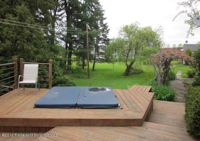 1121 Motichka Road Moscow, PA 18444 - Photo 42 of 59 a view of a wooden deck and garden