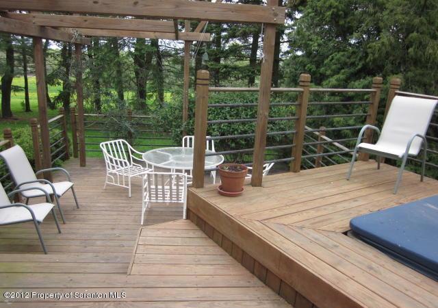 1121 Motichka Road Moscow, PA 18444 - Photo 43 of 59 a view of a chairs and table on the wooden deck