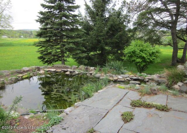 1121 Motichka Road Moscow, PA 18444 - Photo 45 of 59 a view of a lake with beach and outdoor space