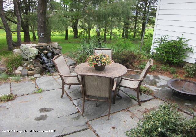 1121 Motichka Road Moscow, PA 18444 - Photo 46 of 59 a table and chairs in a garden