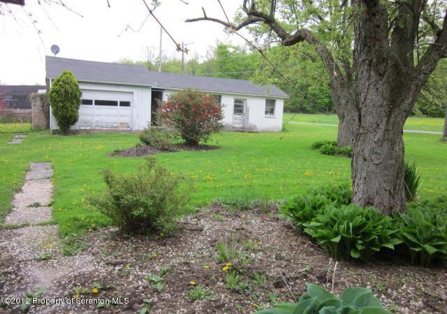 1121 Motichka Road Moscow, PA 18444 - Photo 47 of 59 a front view of a house with garden