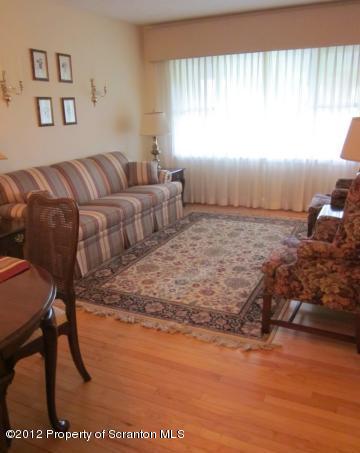 1121 Motichka Road Moscow, PA 18444 - Photo 8 of 59 a living room with furniture and a large window
