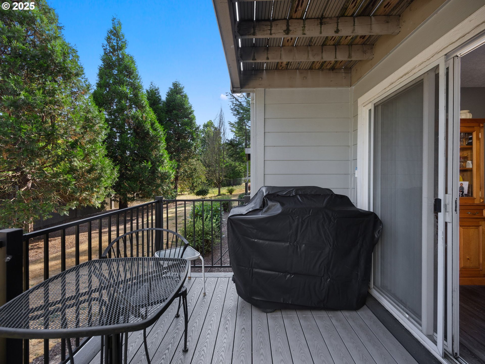 159 Southwest Florence Avenue, Unit 62 Gresham, OR 97080 - Photo 18 of 30 a view of balcony with wooden floor and outdoor seating
