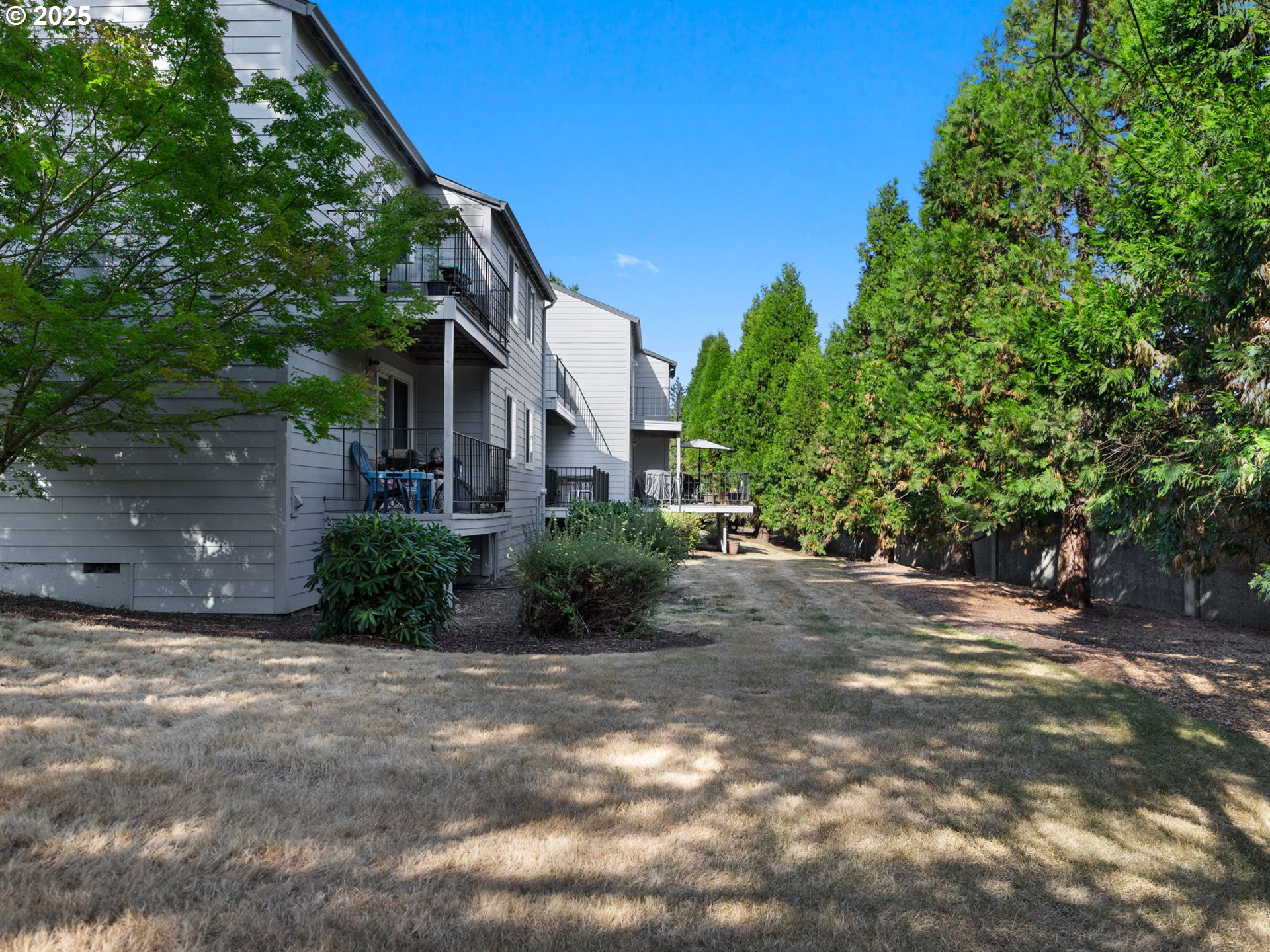 159 Southwest Florence Avenue, Unit 62 Gresham, OR 97080 - Photo 25 of 30 a view of a house with a yard