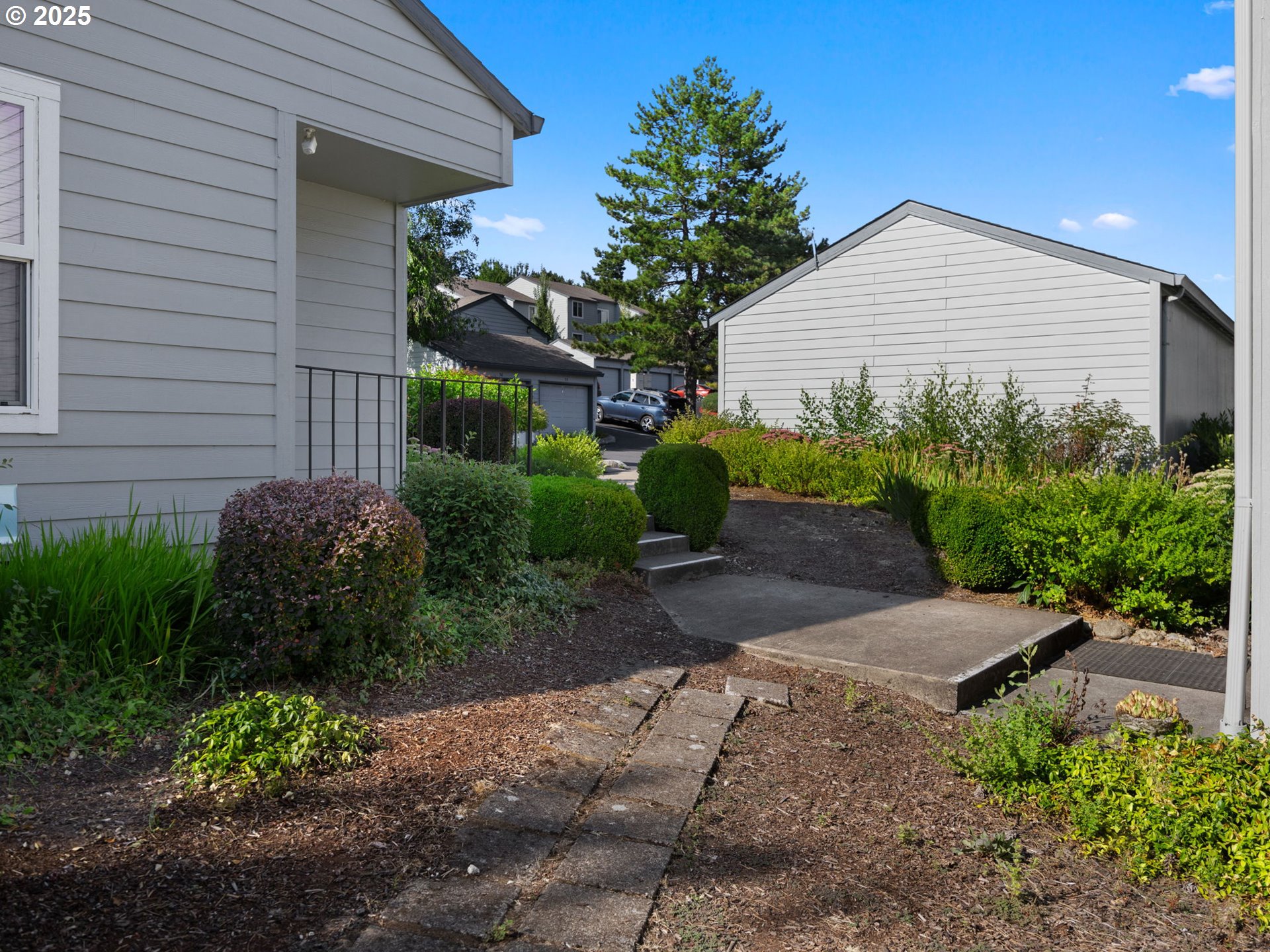 159 Southwest Florence Avenue, Unit 62 Gresham, OR 97080 - Photo 27 of 30 a view of a house with a yard and plants