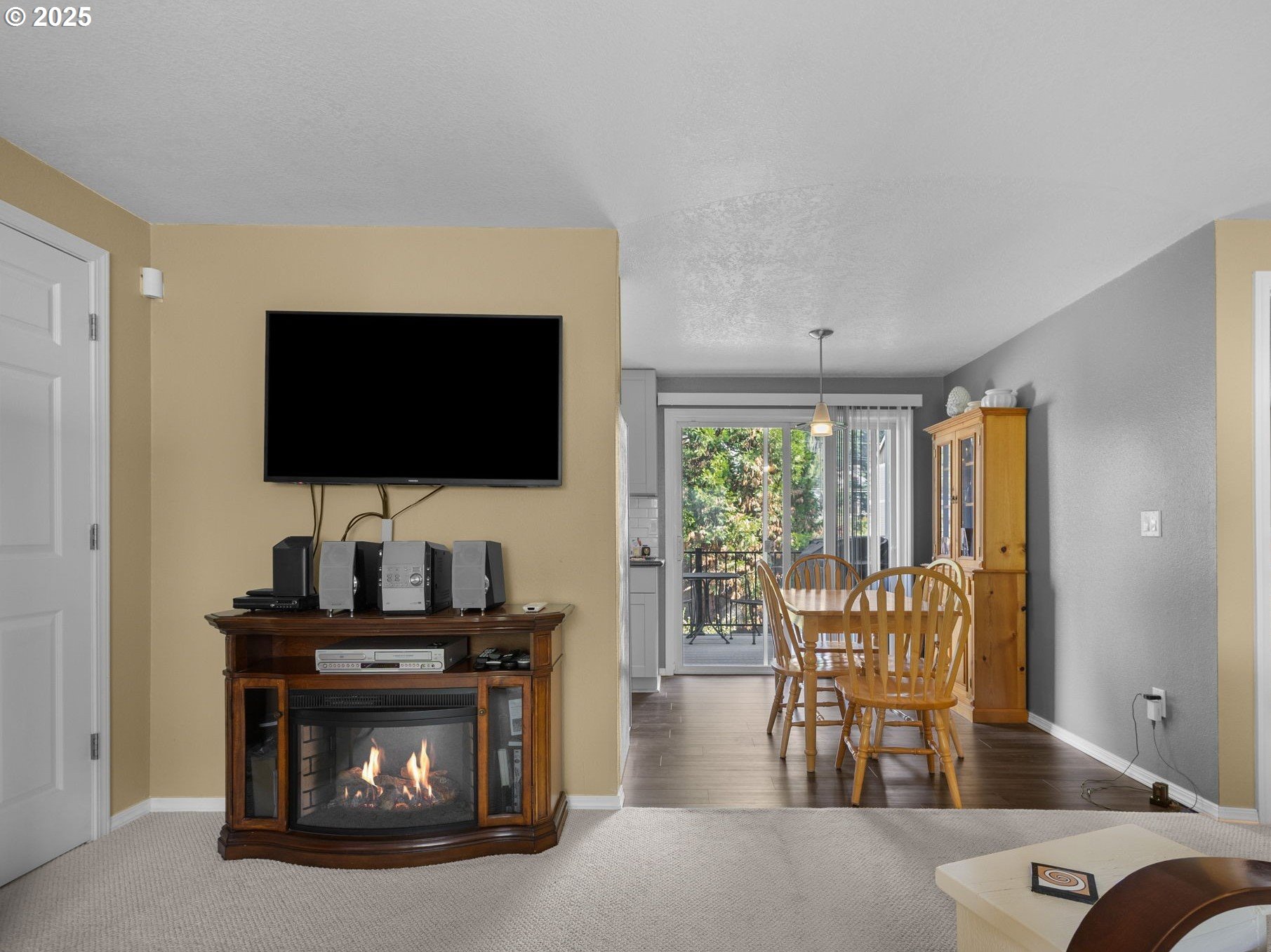 159 Southwest Florence Avenue, Unit 62 Gresham, OR 97080 - Photo 4 of 30 a living room with furniture and a flat screen tv