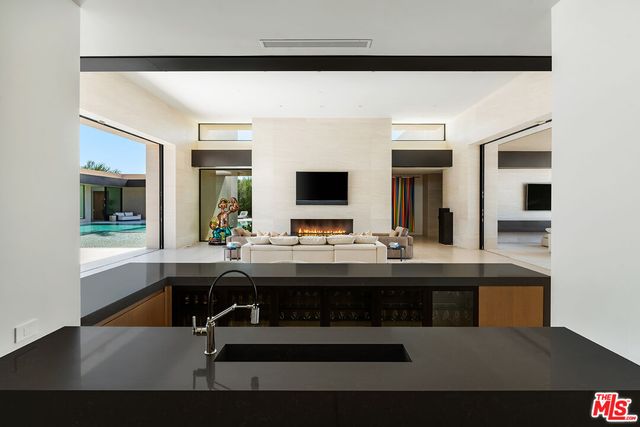 a living room with couches and a flat screen tv