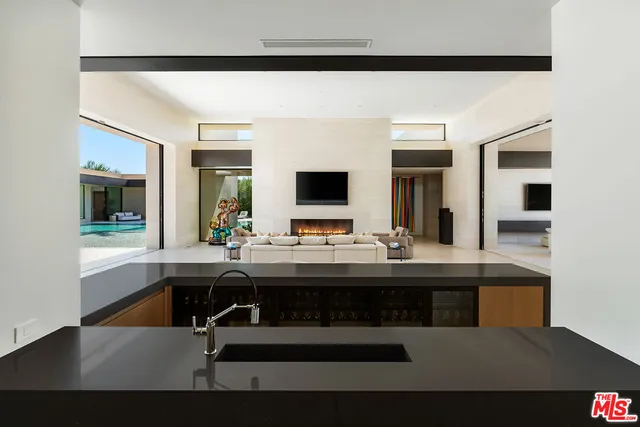 a living room with couches and a flat screen tv